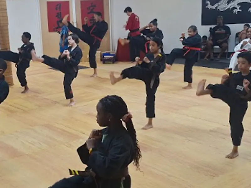 kids in Snellville martial arts class improving focus, discipline, and listening skills through martial arts training