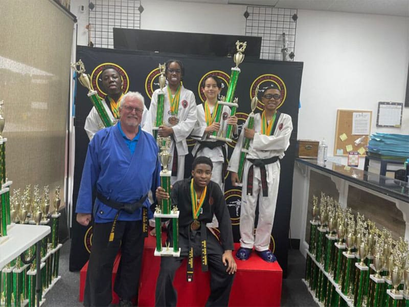 teens in Snellville martial arts class improving focus, discipline, and listening skills through martial arts training